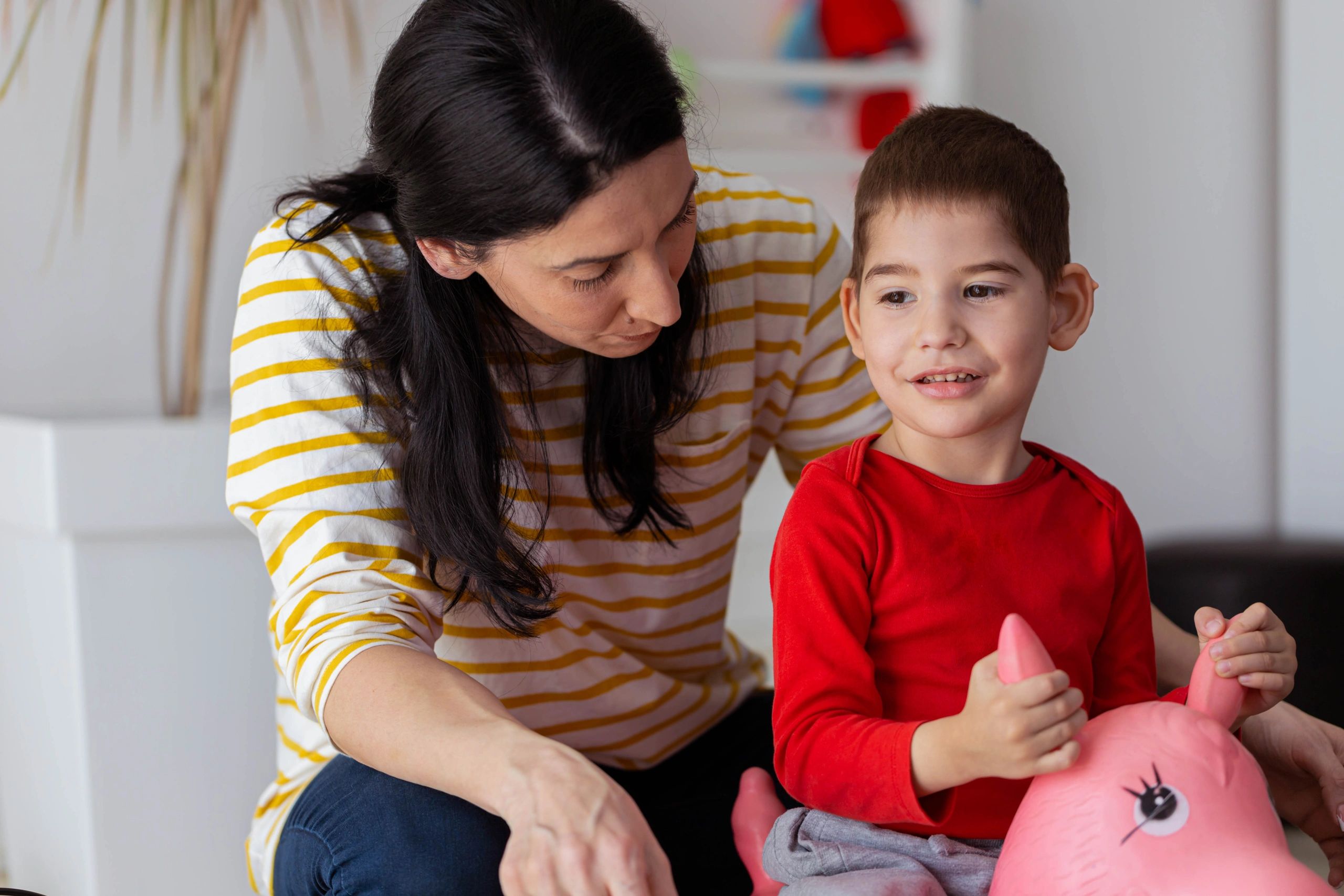 Parent caring for young children in a warm home setting
