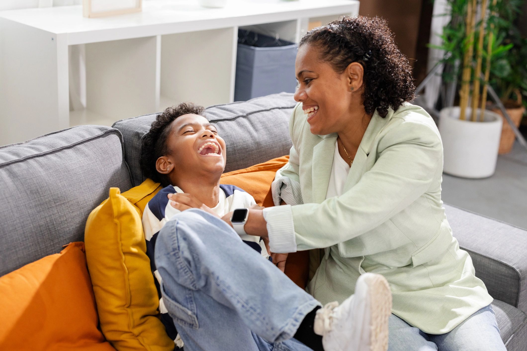 Mother and child sharing a playful moment at home